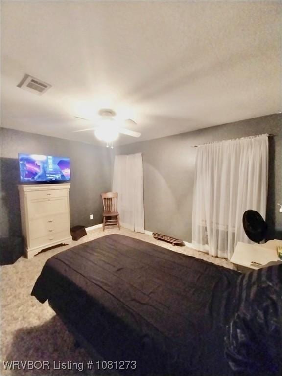 195 Polk 492, Cove, AR 71937 - carpeted bedroom featuring a ceiling fan