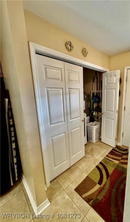 195 Polk 492, Cove, AR 71937 - bedroom featuring light tile patterned floors and a closet