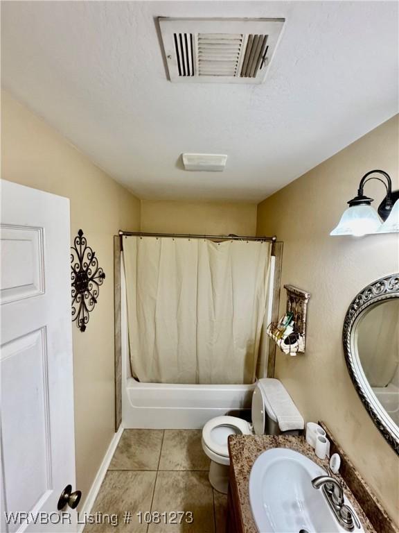 195 Polk 492, Cove, AR 71937 - bathroom with toilet, vanity, shower / bath combo, and tile patterned flooring