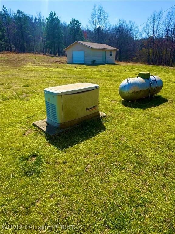 195 Polk 492, Cove, AR 71937 - exterior view of a power unit, a heavily wooded area, and gas tank