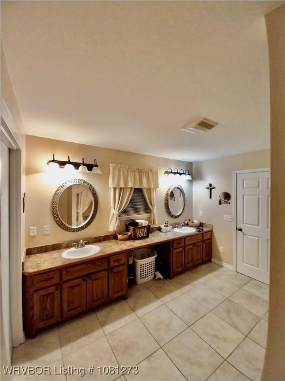 195 Polk 492, Cove, AR 71937 - bathroom featuring tile patterned floors and double vanity
