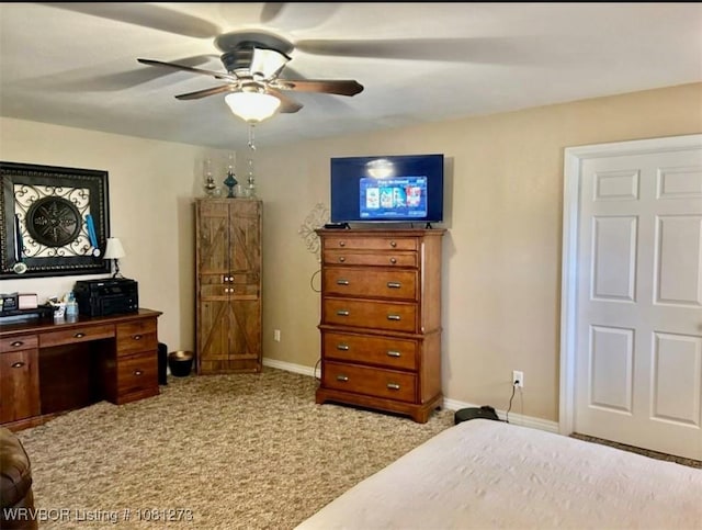 195 Polk 492, Cove, AR 71937 - bedroom featuring light carpet, baseboards, and a ceiling fan