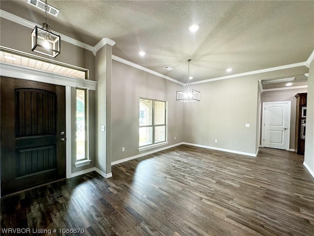 entryway featuring a textured ceiling, dark hardwood / wood-style flooring, and crown molding