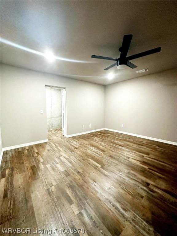 empty room with wood-type flooring and ceiling fan