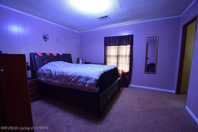 carpeted bedroom featuring crown molding and a textured ceiling