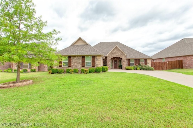 5707 Callaway Ln, Fort Smith, AR 72916 - view of front of home with a shingled roof, concrete driveway, and stone siding