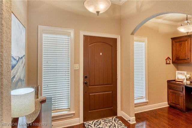 5707 Callaway Ln, Fort Smith, AR 72916 - entryway with ornamental molding, arched walkways, and dark wood-style floors