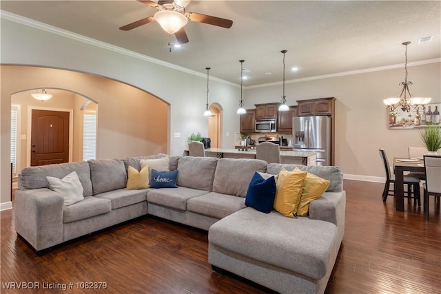5707 Callaway Ln, Fort Smith, AR 72916 - living room with arched walkways, dark wood-style flooring, ceiling fan, a chandelier, and crown molding