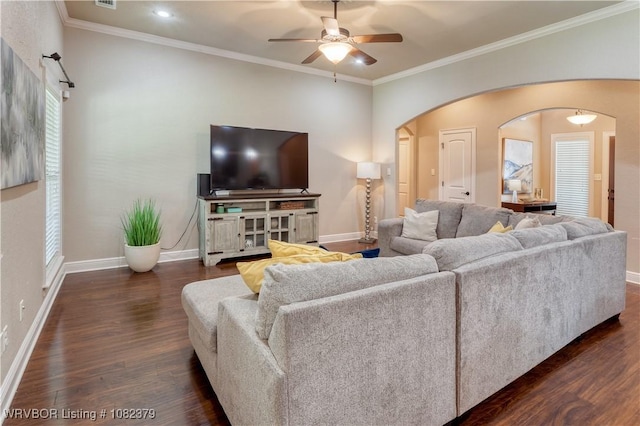 5707 Callaway Ln, Fort Smith, AR 72916 - living room featuring arched walkways, ceiling fan, dark wood-style flooring, ornamental molding, and plenty of natural light