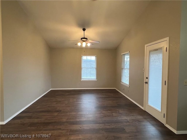 spare room featuring ceiling fan, lofted ceiling, and dark hardwood / wood-style flooring