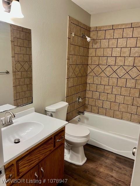 1709 Z St, Fort Smith, AR 72901 - full bath featuring vanity, wood finished floors, toilet, and bathtub / shower combination