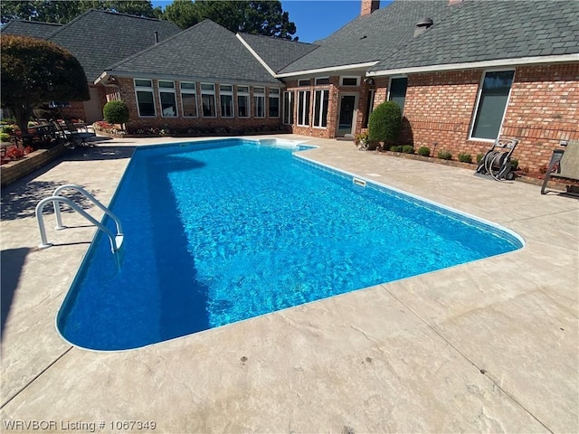 view of swimming pool featuring a patio