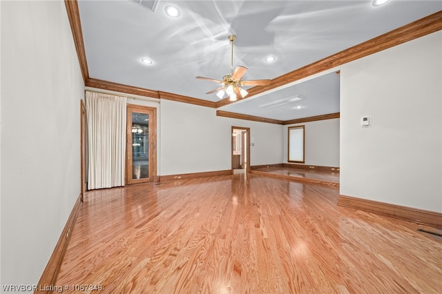 empty room with light hardwood / wood-style flooring, ceiling fan, and crown molding