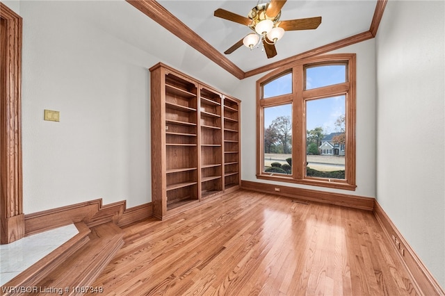 unfurnished room with light wood-type flooring, ceiling fan, and ornamental molding