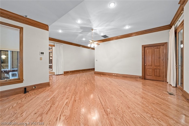 unfurnished living room featuring ceiling fan, light wood-type flooring, and ornamental molding