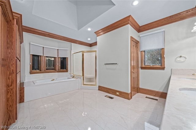 bathroom featuring vanity, crown molding, and independent shower and bath