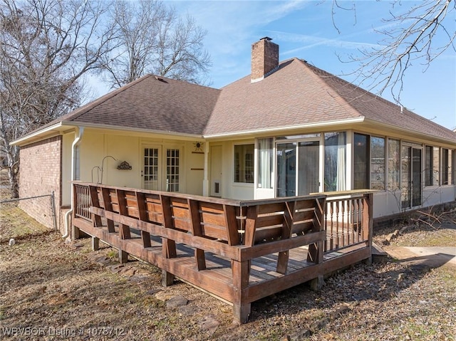 back of property featuring a sunroom