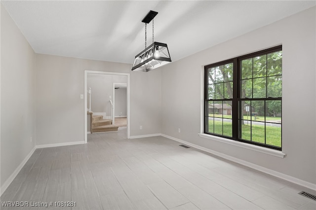 8901 Royal Ridge Dr, Fort Smith, AR 72903 - unfurnished dining area with stairway and baseboards