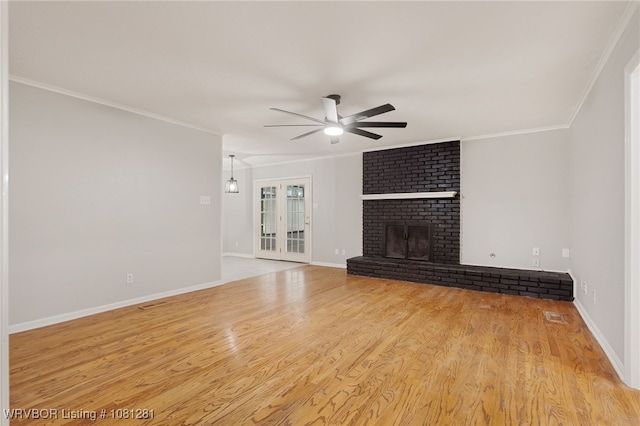 8901 Royal Ridge Dr, Fort Smith, AR 72903 - unfurnished living room with ceiling fan, crown molding, wood finished floors, a fireplace, and baseboards