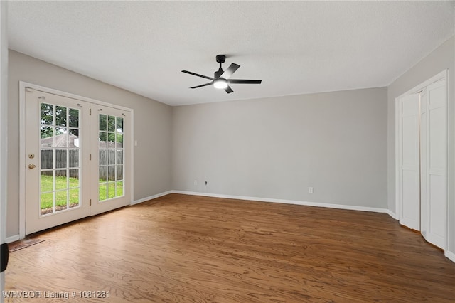 8901 Royal Ridge Dr, Fort Smith, AR 72903 - unfurnished room with a ceiling fan, wood finished floors, and baseboards
