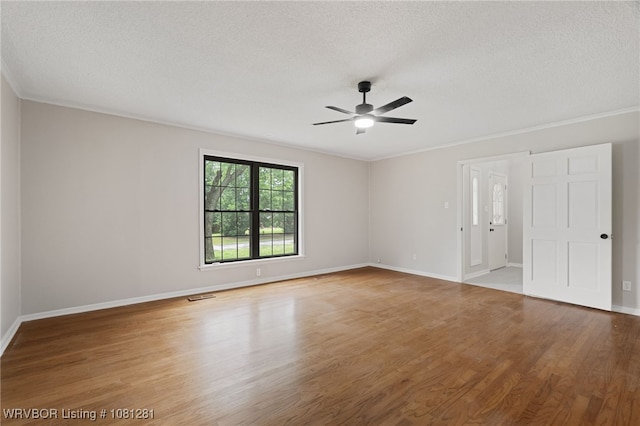 8901 Royal Ridge Dr, Fort Smith, AR 72903 - spare room featuring ceiling fan, wood finished floors, a textured ceiling, baseboards, and crown molding