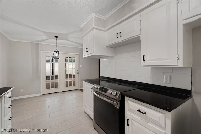8901 Royal Ridge Dr, Fort Smith, AR 72903 - kitchen with stainless steel electric range oven, dark countertops, decorative backsplash, white cabinets, and crown molding