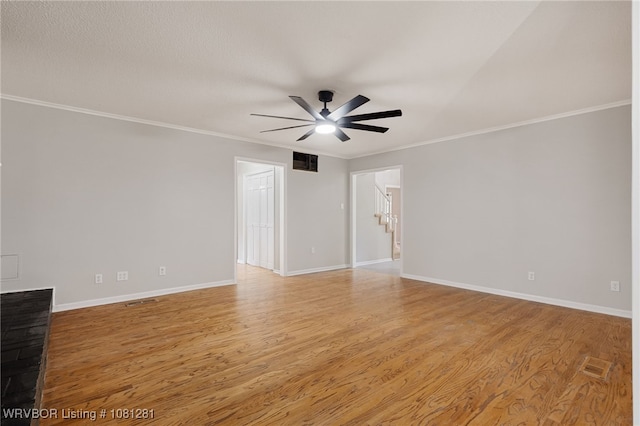 8901 Royal Ridge Dr, Fort Smith, AR 72903 - empty room with ceiling fan, light wood-style floors, crown molding, and baseboards