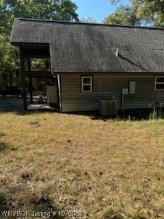 185 Susie Ln, Mena, AR 71953 - rear view of property with central AC and a lawn