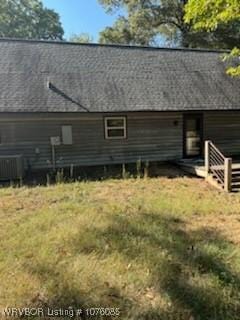 185 Susie Ln, Mena, AR 71953 - back of property featuring a yard and cooling unit