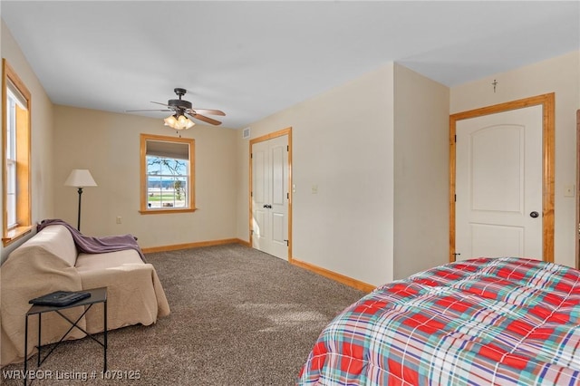 bedroom featuring ceiling fan, carpet floors, and baseboards