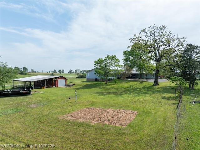 255 Spielerville Rd, Paris, AR 72855 - view of yard featuring a pole building, a detached garage, and an outbuilding