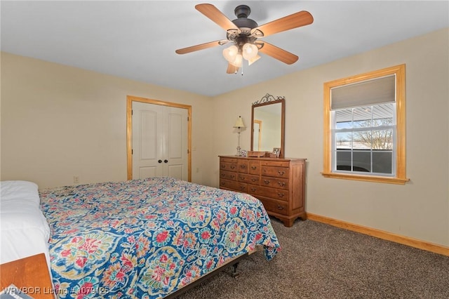 bedroom with carpet, a closet, baseboards, and a ceiling fan