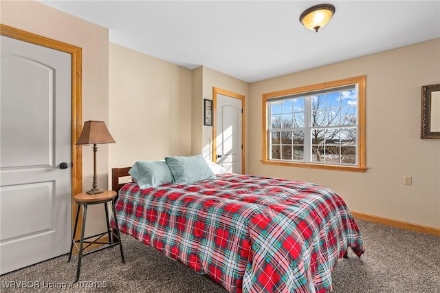 carpeted bedroom featuring baseboards