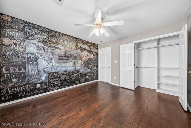1129 Arapahoe Dr, Van Buren, AR 72956 - unfurnished bedroom featuring wood finished floors, wallpapered walls, and ceiling fan
