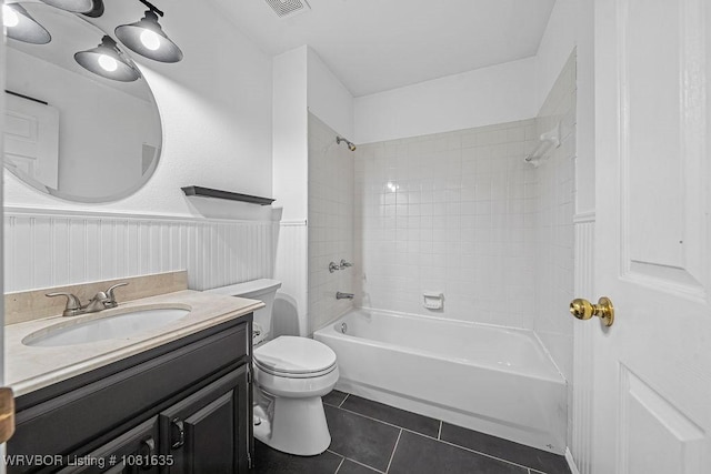 1129 Arapahoe Dr, Van Buren, AR 72956 - bathroom featuring tile patterned floors, shower / bathtub combination, vanity, and a wainscoted wall