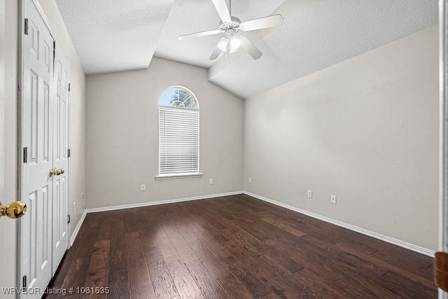1129 Arapahoe Dr, Van Buren, AR 72956 - unfurnished bedroom featuring dark wood-type flooring, lofted ceiling, a textured ceiling, and ceiling fan