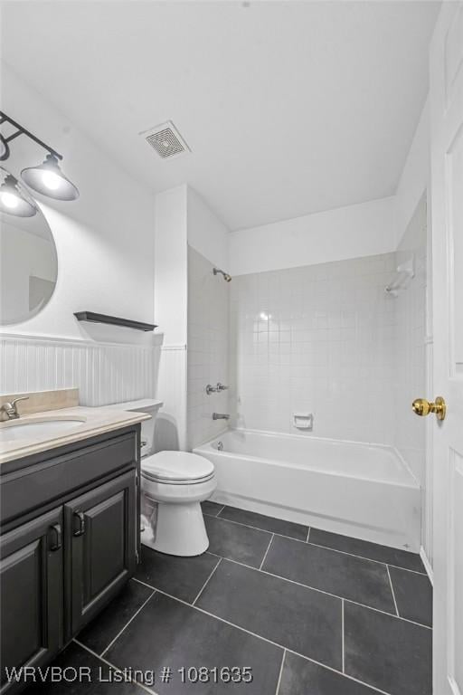 1129 Arapahoe Dr, Van Buren, AR 72956 - full bath with vanity, shower / washtub combination, tile patterned flooring, and wainscoting