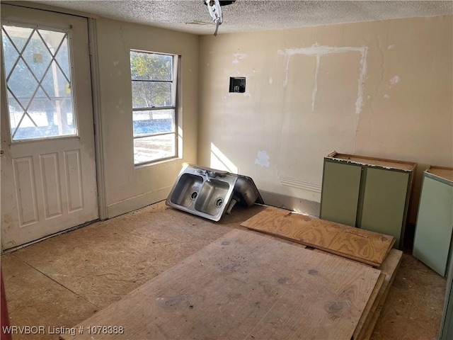 interior space featuring a textured ceiling