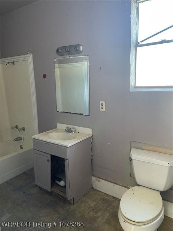 full bathroom featuring shower / bathtub combination, vanity, and toilet