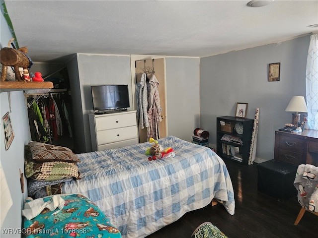 bedroom featuring a closet and hardwood / wood-style floors