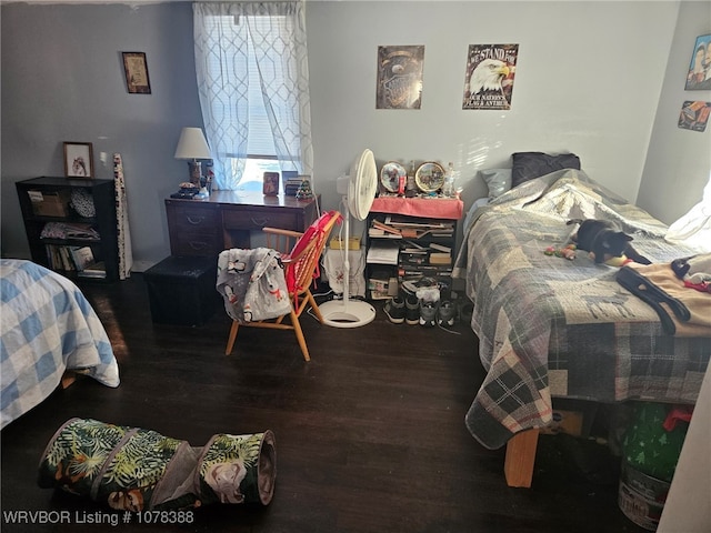 bedroom with hardwood / wood-style floors