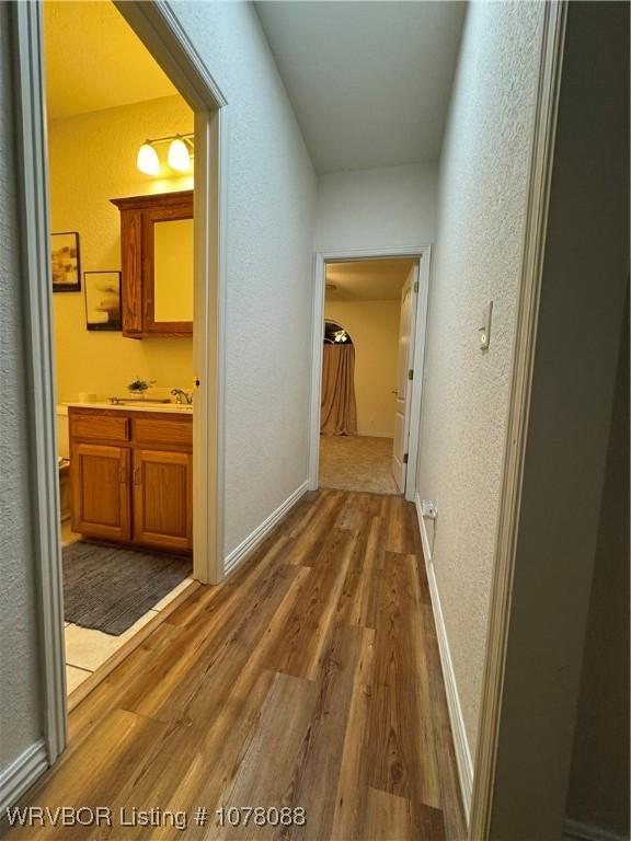 corridor featuring hardwood / wood-style flooring