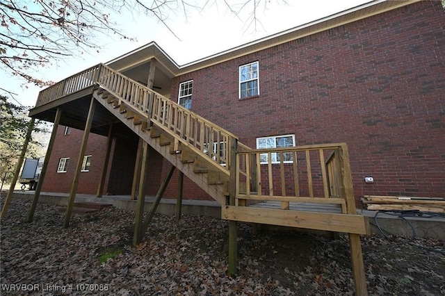 back of house featuring a wooden deck