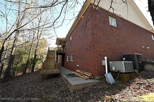 view of home's exterior featuring central air condition unit