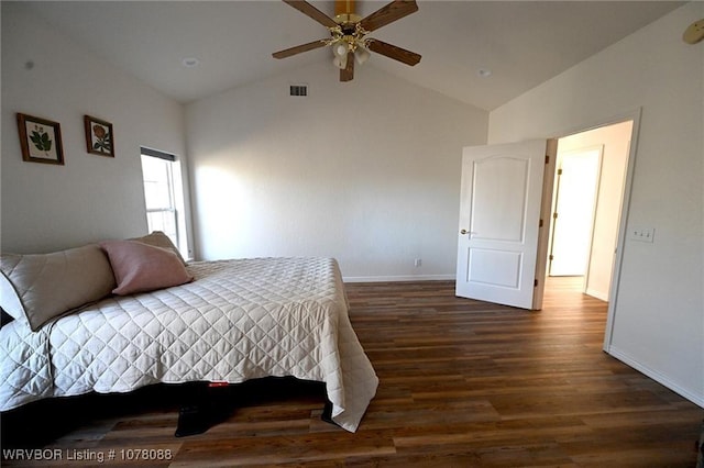 bedroom featuring ceiling fan, dark hardwood / wood-style flooring, and vaulted ceiling