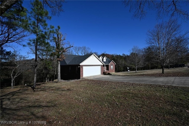 view of home's exterior with a yard and a garage