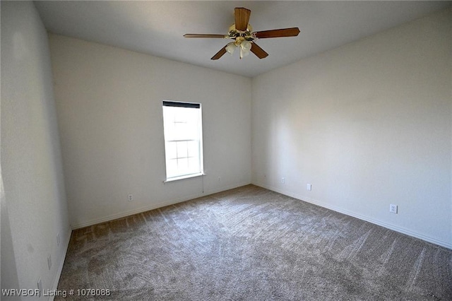 carpeted empty room featuring ceiling fan