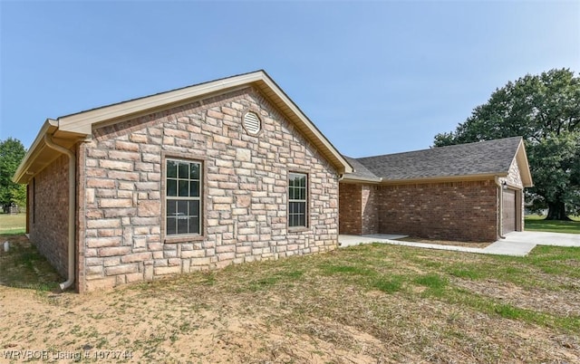 view of side of property featuring a garage