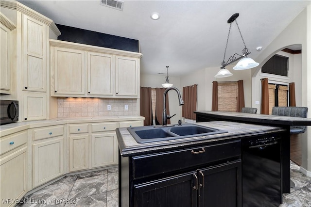 kitchen with black appliances, sink, an island with sink, tasteful backsplash, and decorative light fixtures