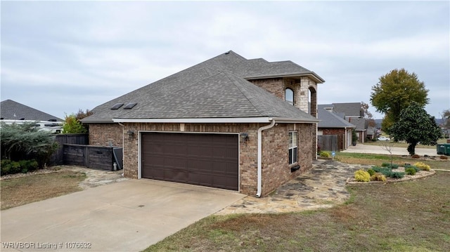 view of side of property featuring a garage